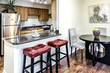 Fitted kitchen with island dining